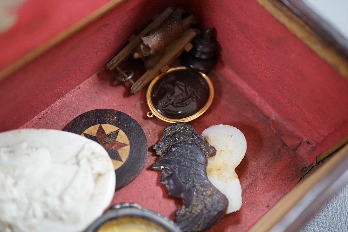 A 19th century yellow metal mounted intaglio pendant, assorted unmounted cameos, snuff box and collectables. Condition - varies